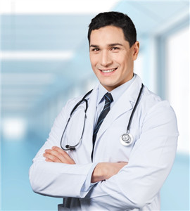 Young male doctor in cross arms pose